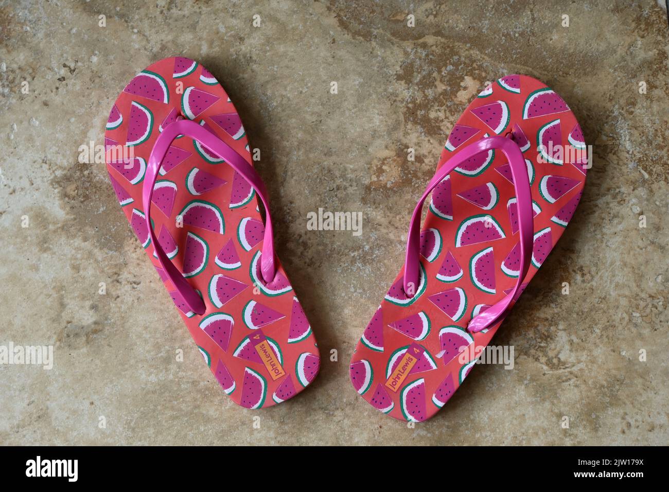 pair of womens flip flops with watermelon design Stock Photo