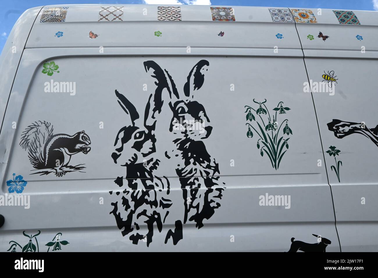 van decorated with animals and flowers Stock Photo