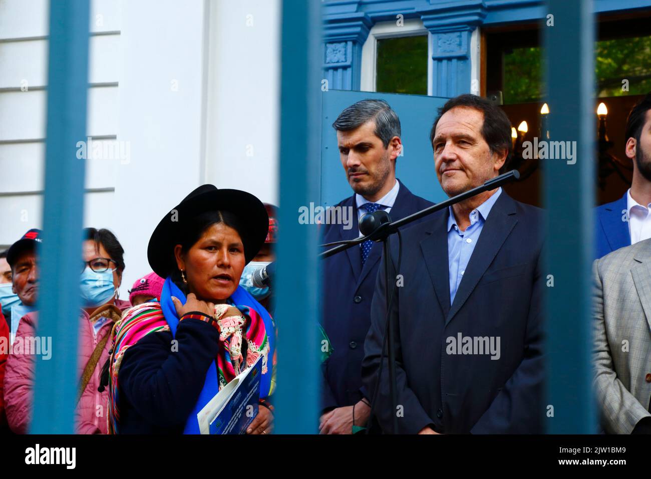 Sopocachi, La Paz, Bolivia, 2nd September 2022: The leader of Bolivia's National Confederation of Indigenous and Campesina Women - Bartolina Sisa social movement Segundina Flores makes a speech outside the Argentine Embassy in La Paz to show support for Argentina's vice president Cristina Fernández de Kirchner, who narrowly survived an assassination attempt outside her home in Buenos Aires yesterday evening. On the right is the Argentine Ambassador to Bolivia Ariel Basteiro. Stock Photo