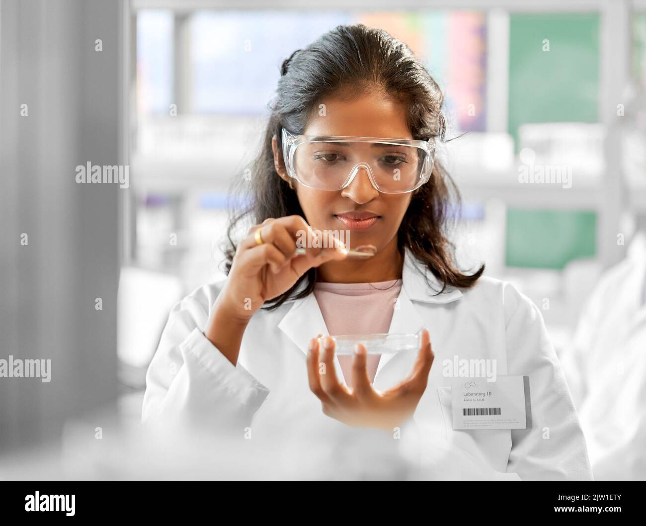 scientist with petri dish working in laboratory Stock Photo - Alamy