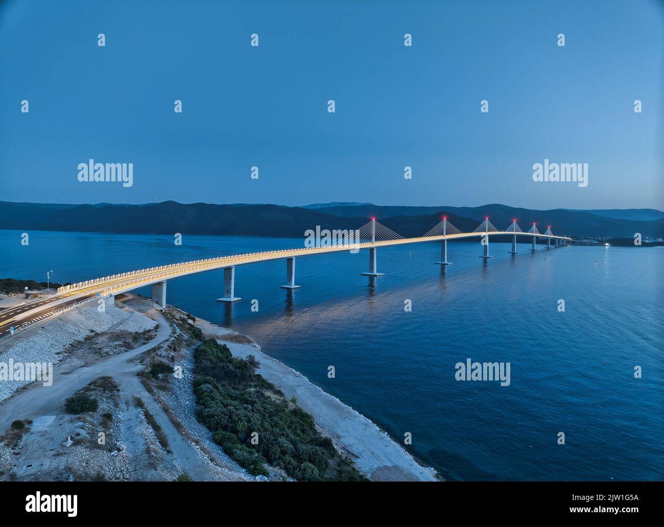 Aerial of the Peljesac bridge at dusk Stock Photo