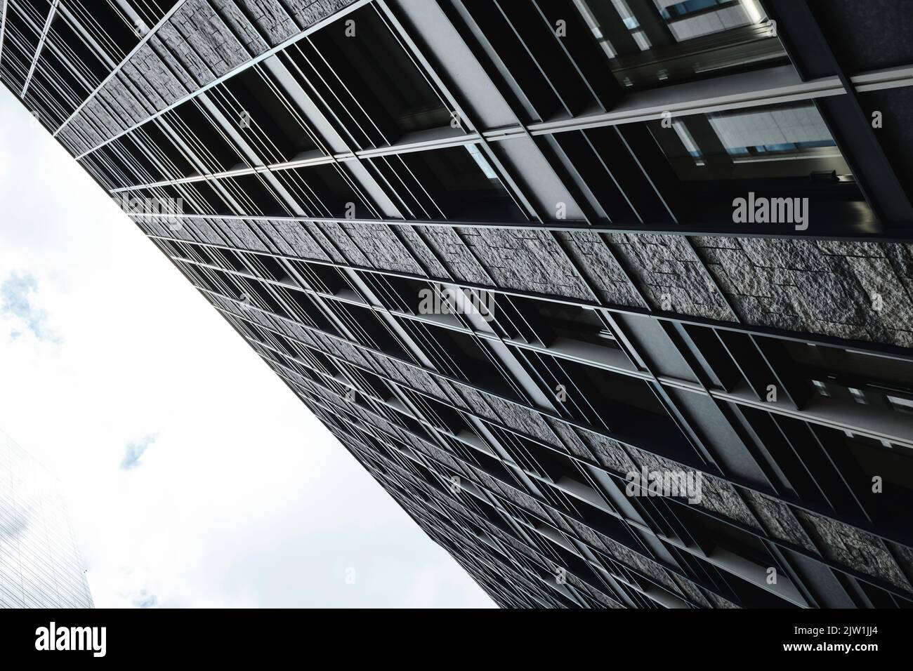 Urban Office Building Closeup with Cloudy Sky Stock Photo - Alamy