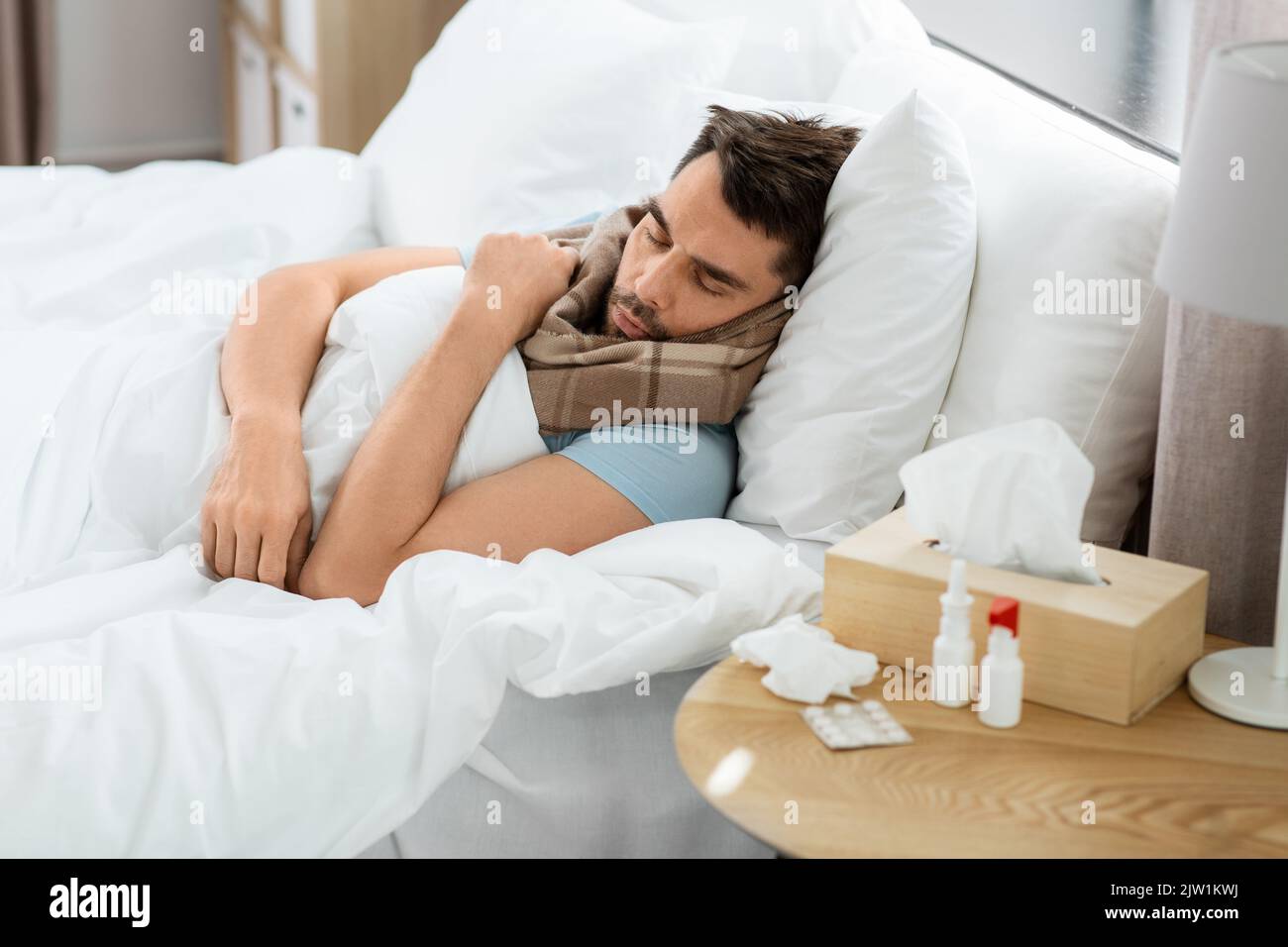 sick man sleeping in bed at home Stock Photo Alamy
