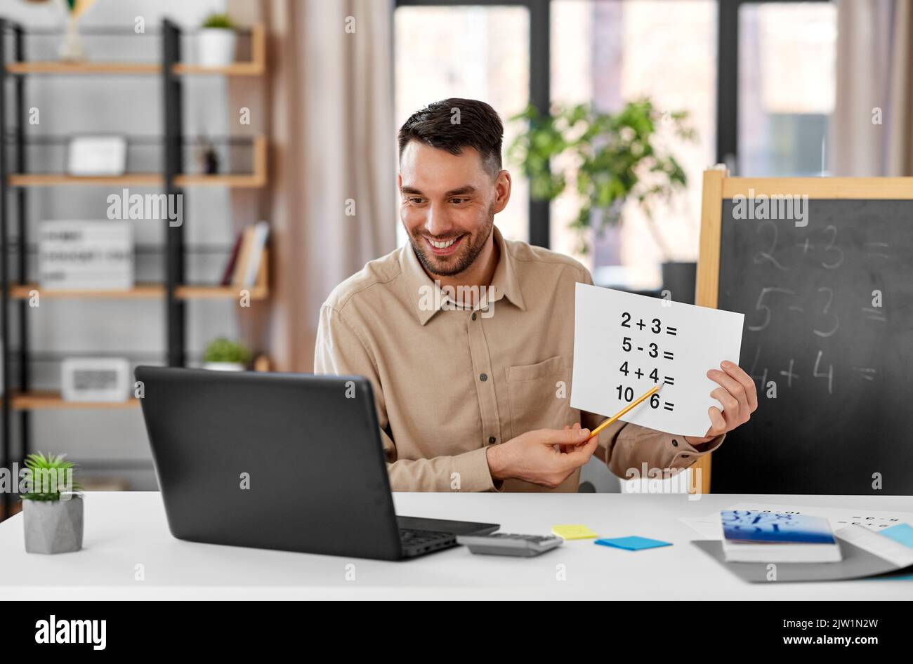 Male teacher smiling chalkboard hi-res stock photography and images - Alamy