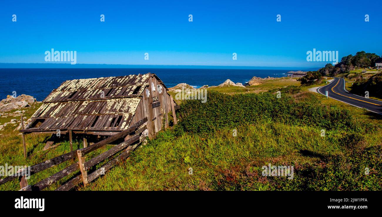 Pacific coast highway 1 in northern California where a barn is next to the ocean. Stock Photo