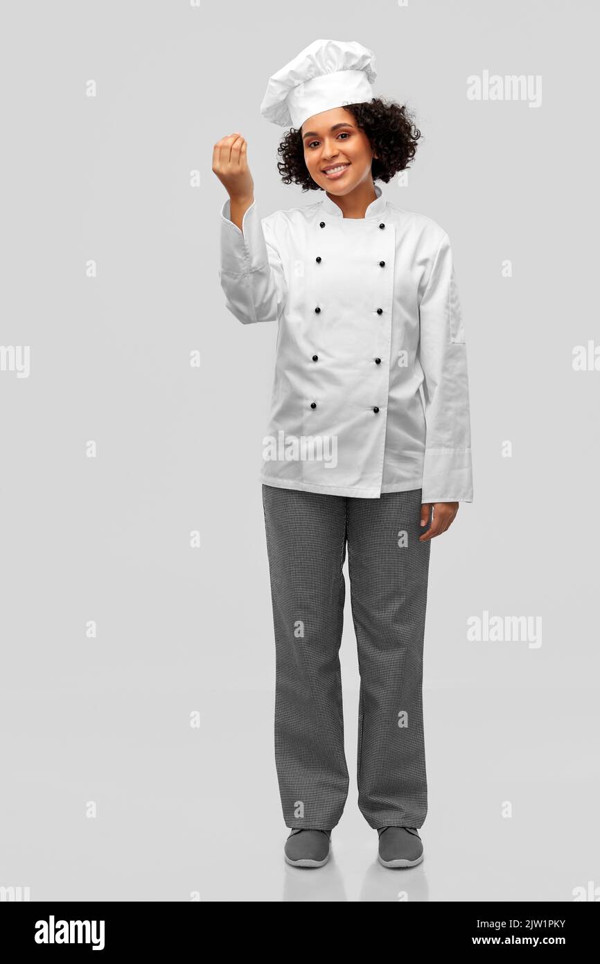 happy female chef showing gourmet sign Stock Photo Alamy