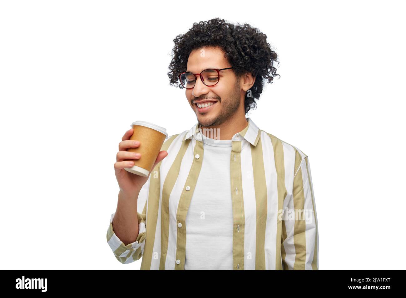 smiling young man with takeaway coffee cup Stock Photo