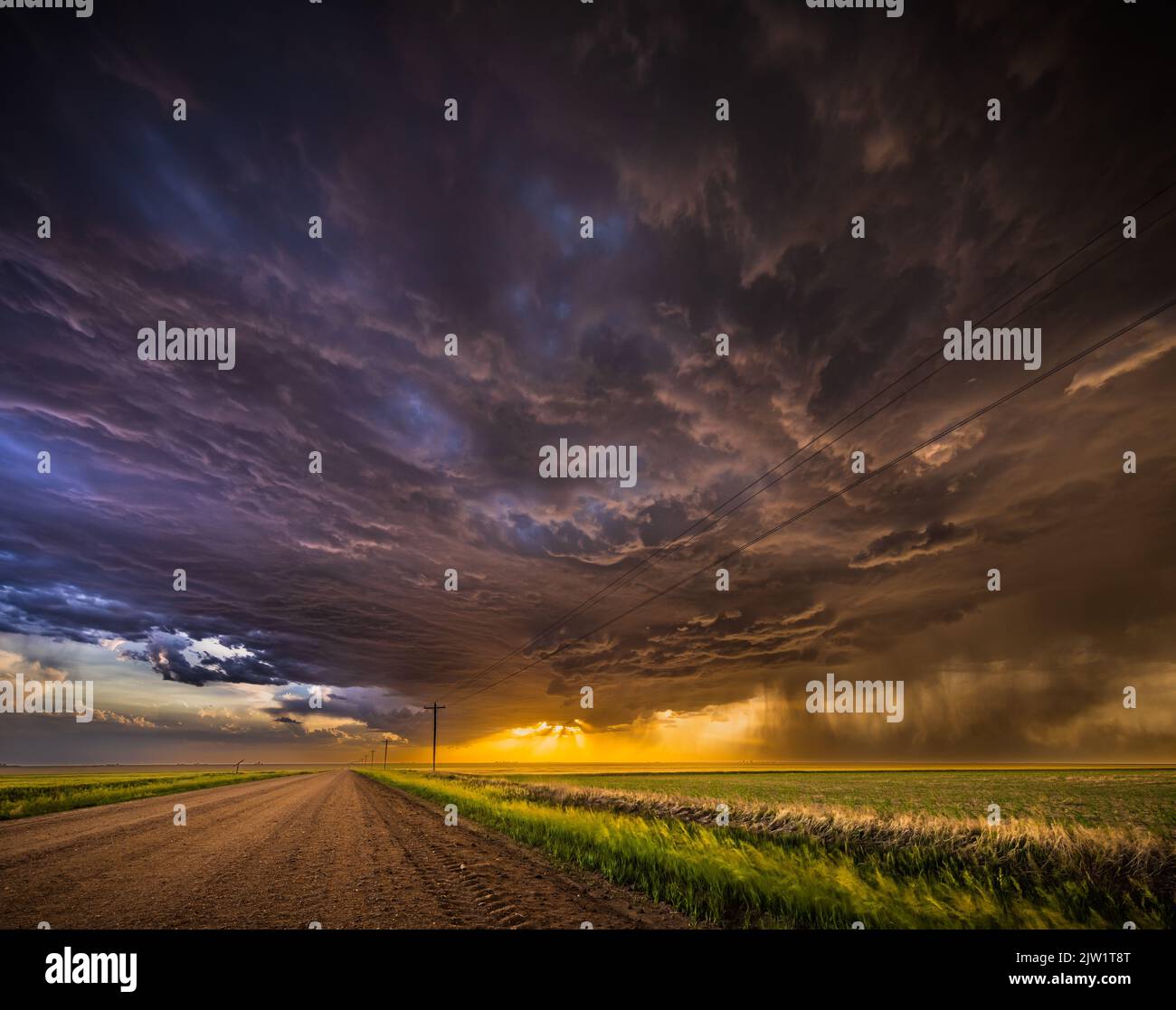 Storrmy skies over rural road near Grinnell, Kansas Stock Photo