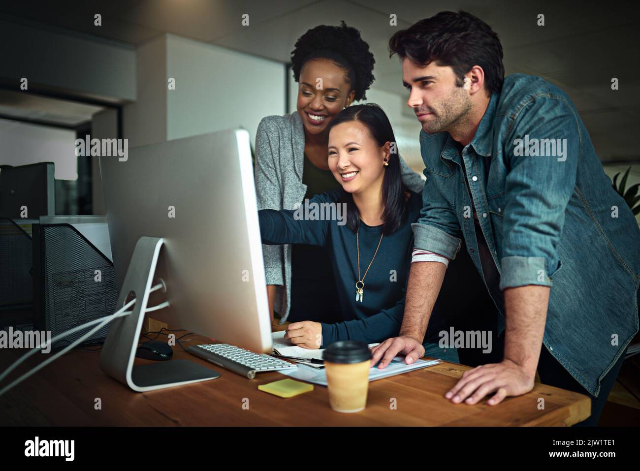 Creative collaborations. three young designers working in the office. Stock Photo