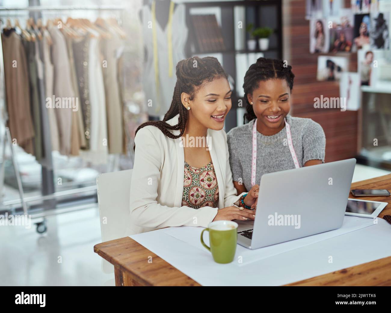 It all starts with a design. two young fashion designers working on a laptop. Stock Photo