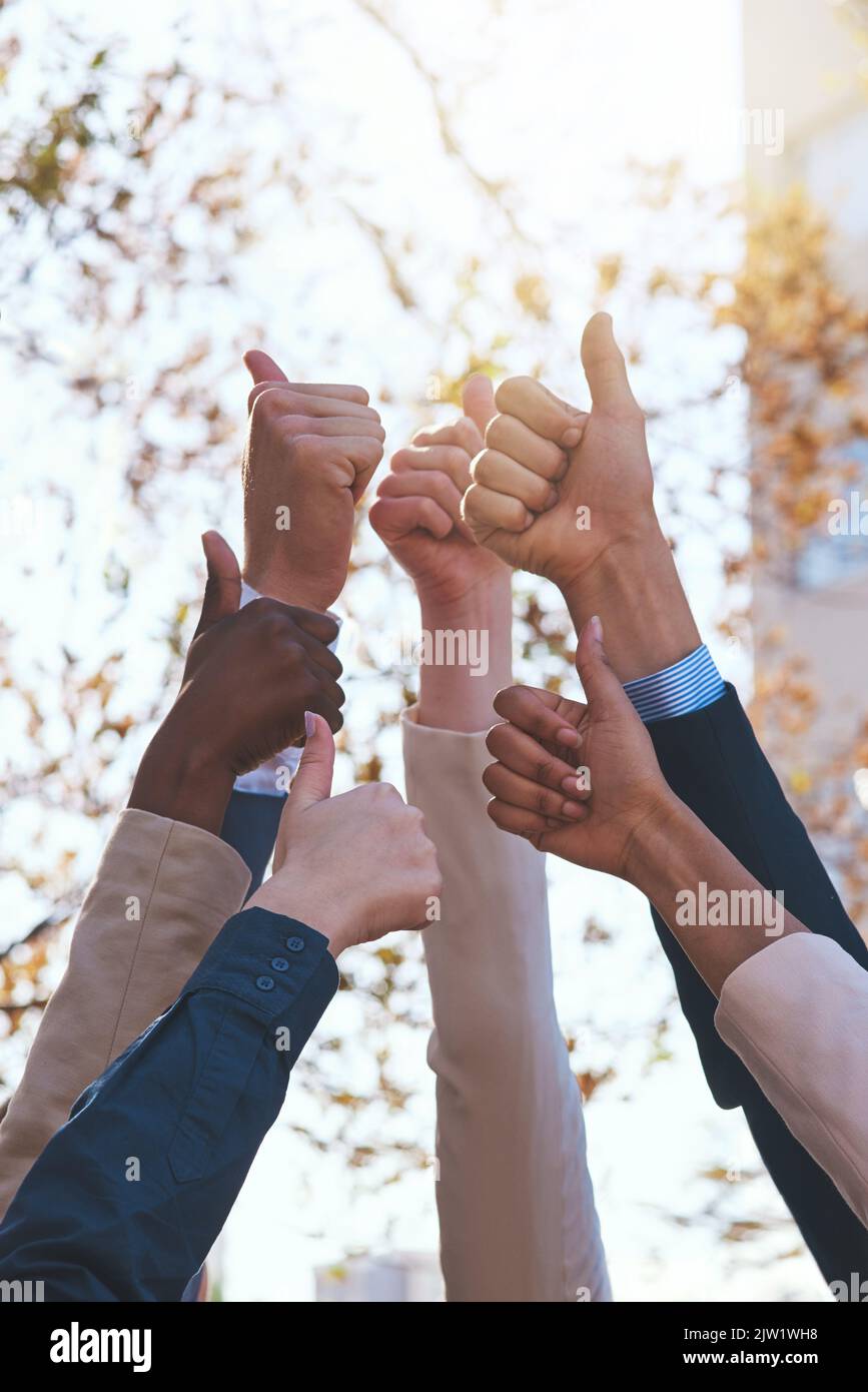 Excellent. a group of hands showing thumbs up Stock Photo - Alamy