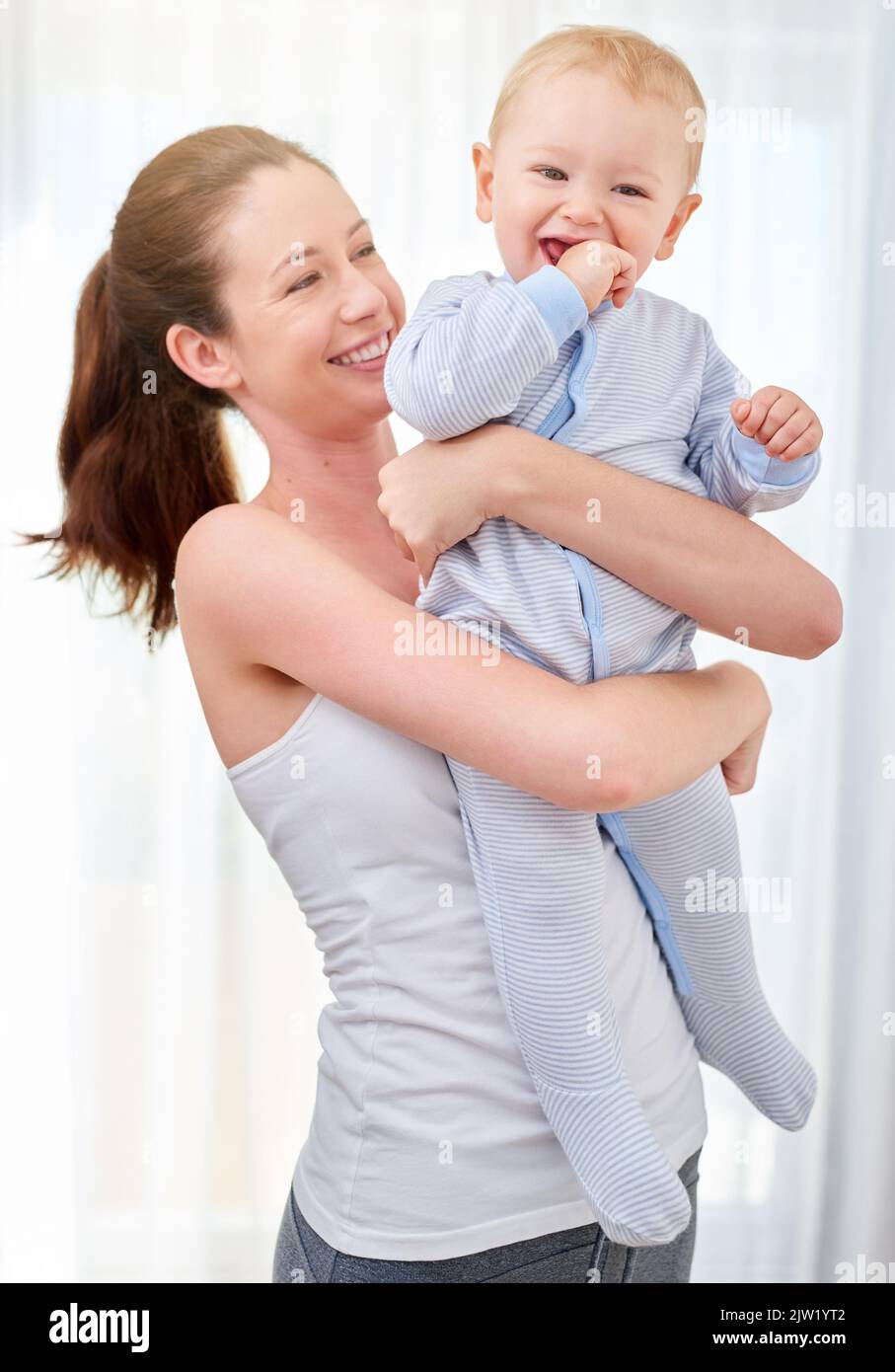 He makes working out fun to do. a mother bonding with her baby boy. Stock Photo