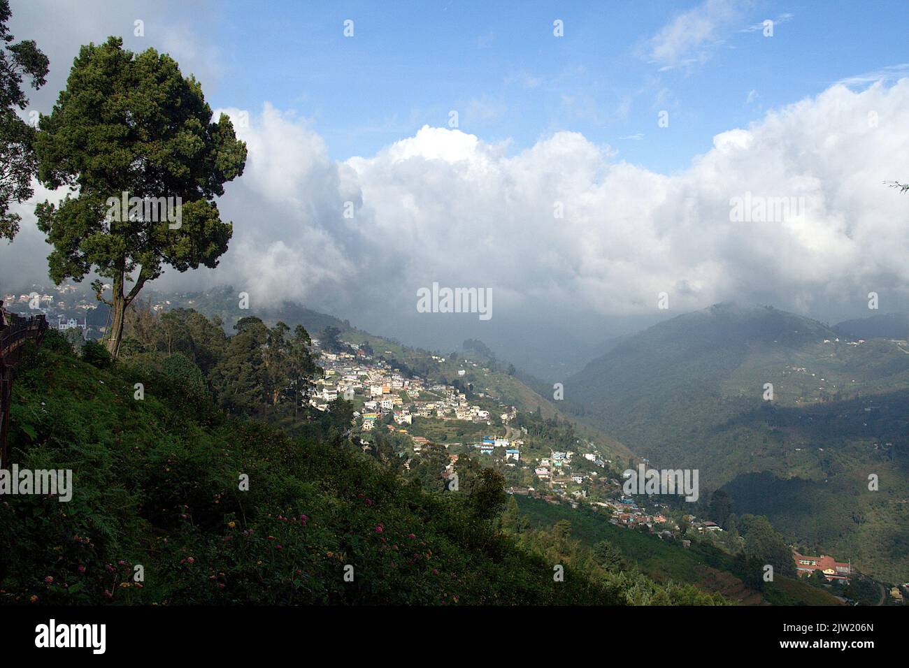 View of sloping landscape and town from Pillar Rock Point at Kodaikanal in Tamil Nadu, India, Asia Stock Photo