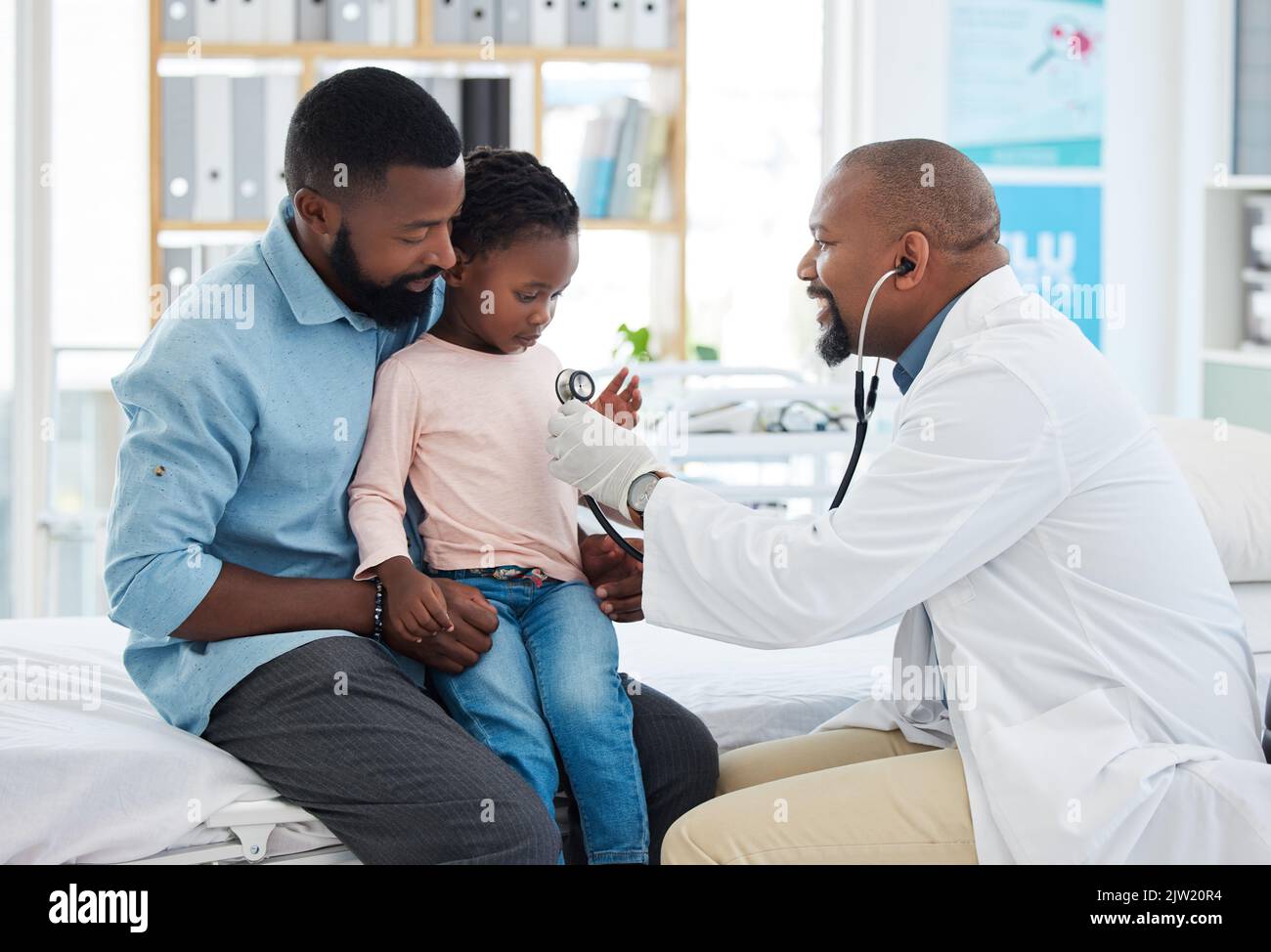 Black family, girl and pediatrician doctor with stethoscope, consulting
