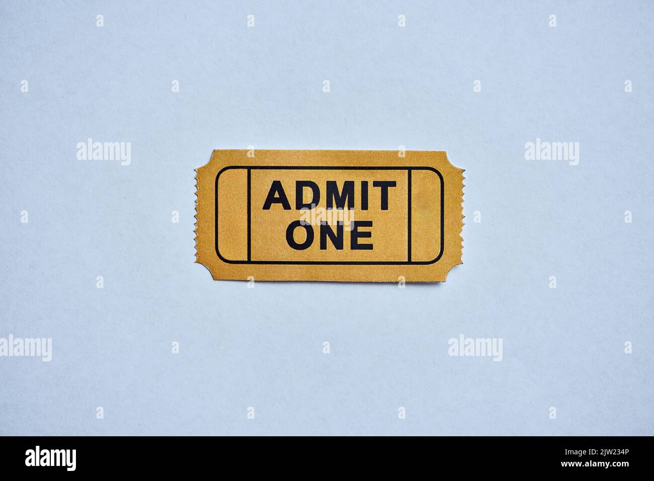 This is where the fun starts. a yellow movie ticket isolated on white. Stock Photo