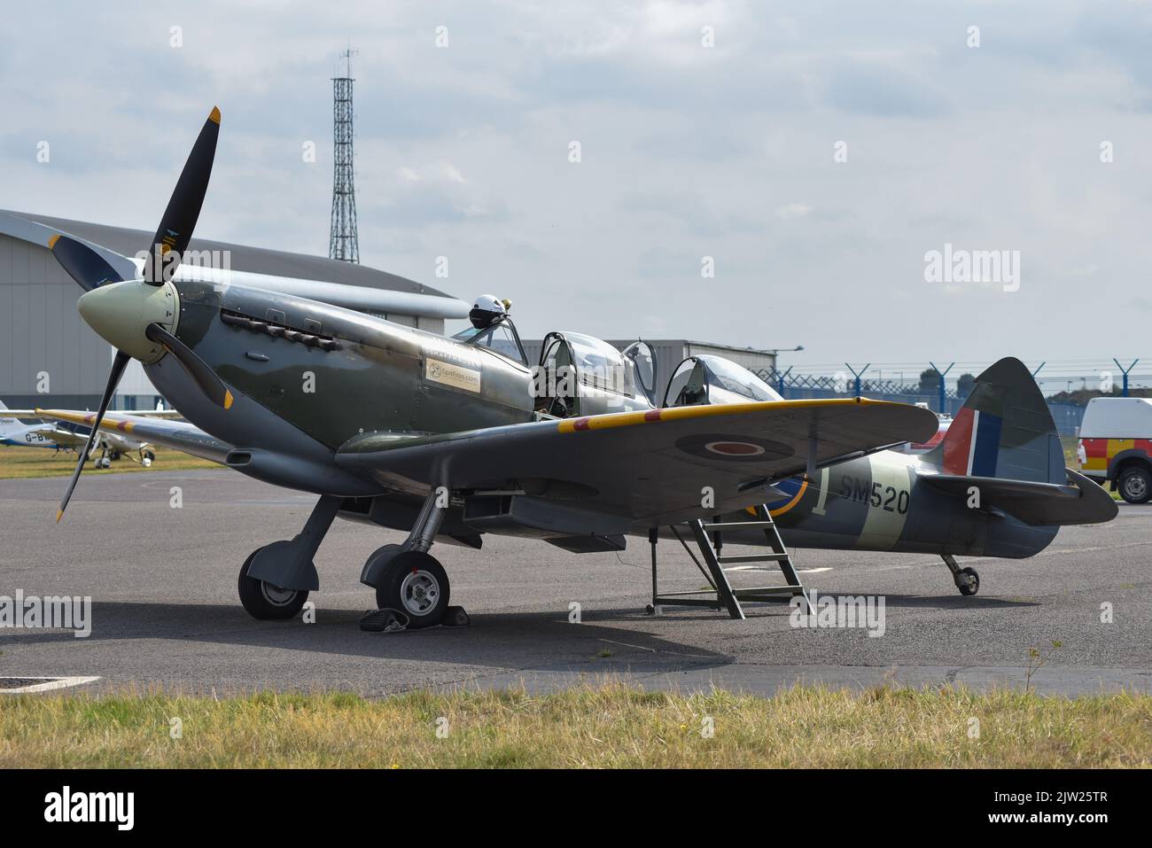 SM250 twin seat Spitfire parked on the runway of Solent airport in England. Stock Photo