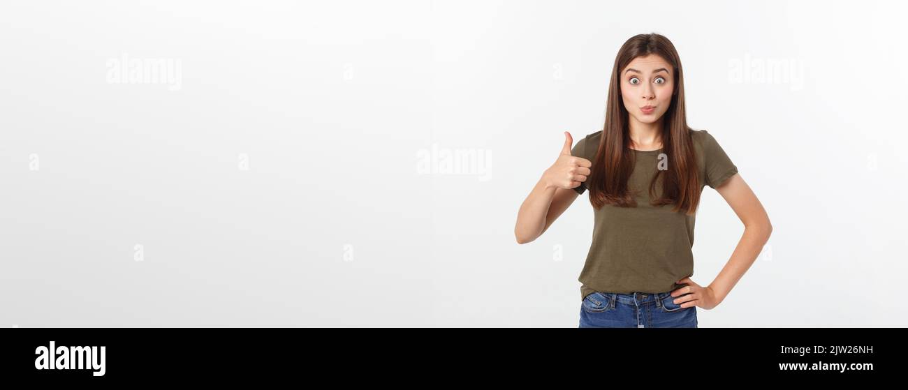 Closeup portrait of a beautiful young woman showing thumbs up sign ...