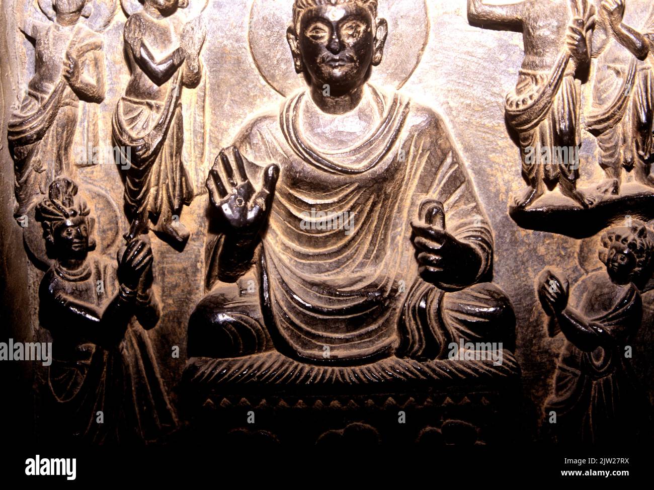 Bronze relief of the seated Buddha, Gandhara era, 3BCE, Lahore Museum Pakistan Stock Photo