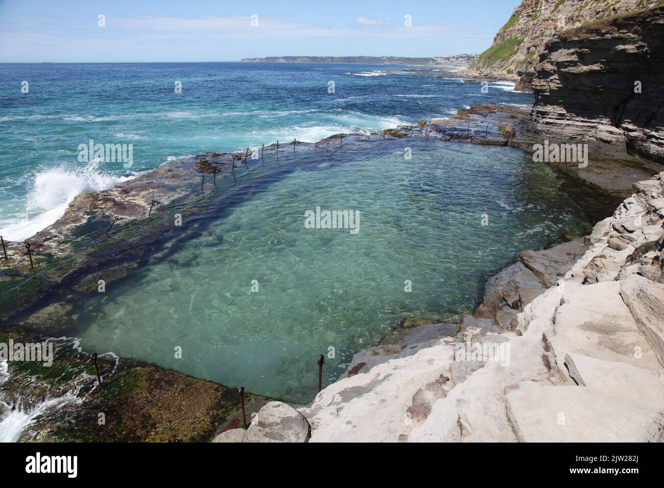 The bogie hole an ocean bath built in the 19th century using convict labour. It is one of the oldest ocean baths in Australia. The Bogie Hole - Newcas Stock Photo