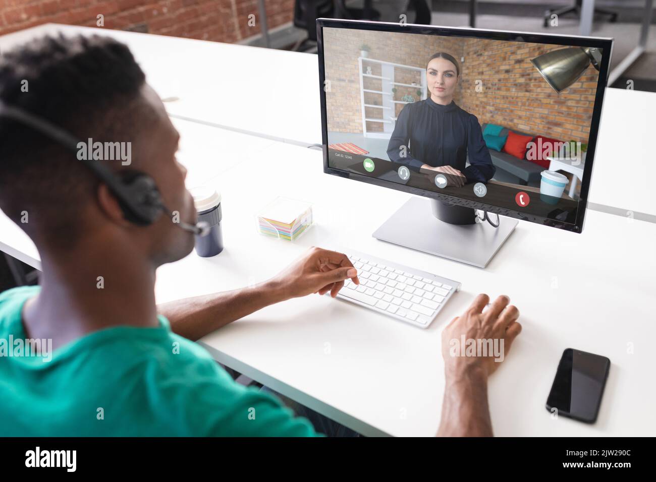African american businessman discussing on video conference with caucasian businesswoman in office Stock Photo