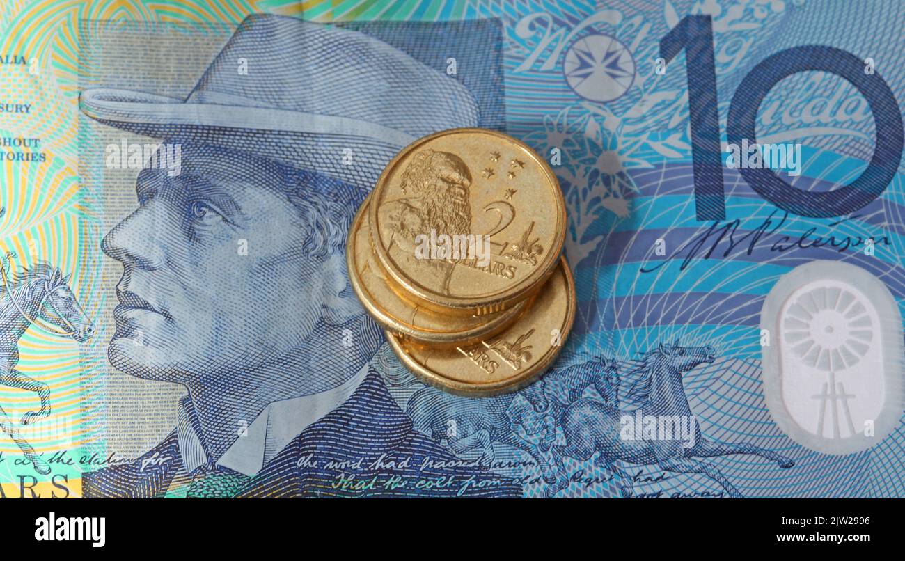 An Australian ten dollar note with Australian two dollar coins. Stock Photo