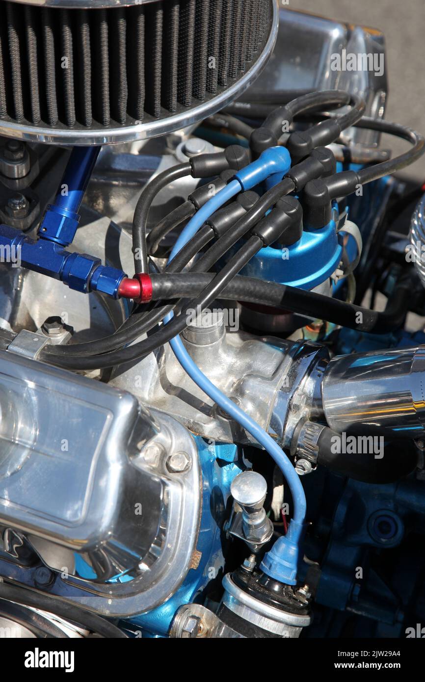 Closeup detail of a hotrods engine showing the distributor cap and leads Stock Photo