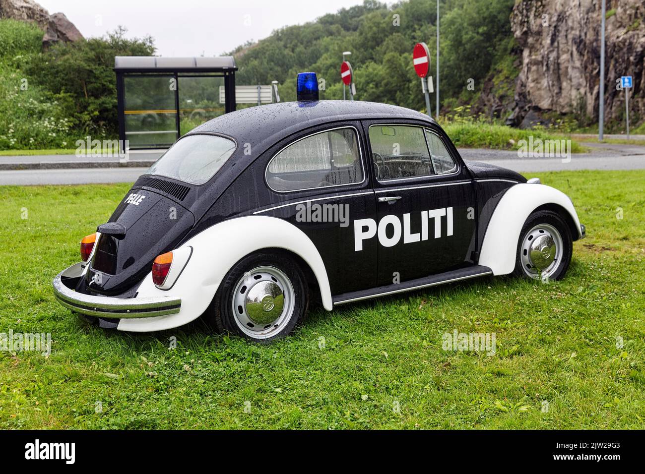 Black and white police patrol car with lettering Politi, VW Beetle, classic car from 1965 with blue light, standing in a meadow, Bodo, Bodo Stock Photo