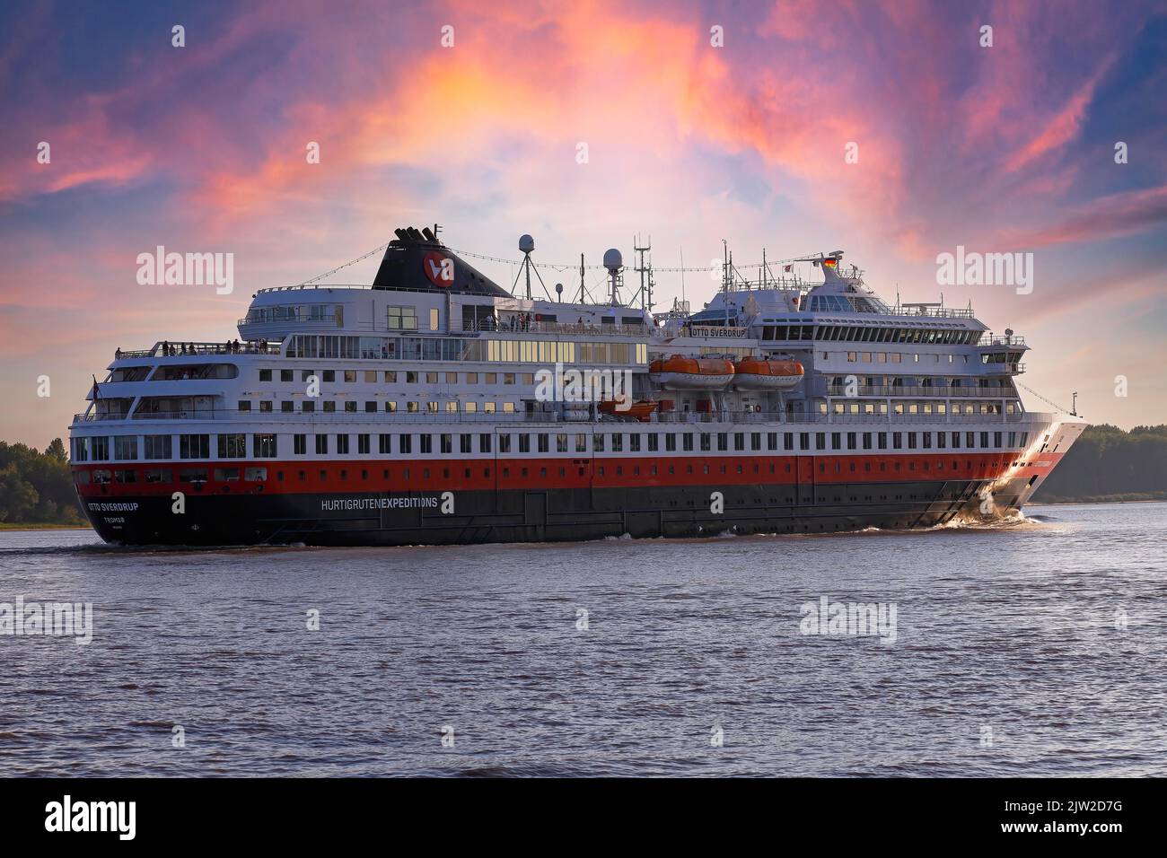 Cruise ship MS Otto Sverdrup, Hurtigruten, leaving the port of Hamburg in the evening light on the Elbe, Hamburg, Germany Stock Photo