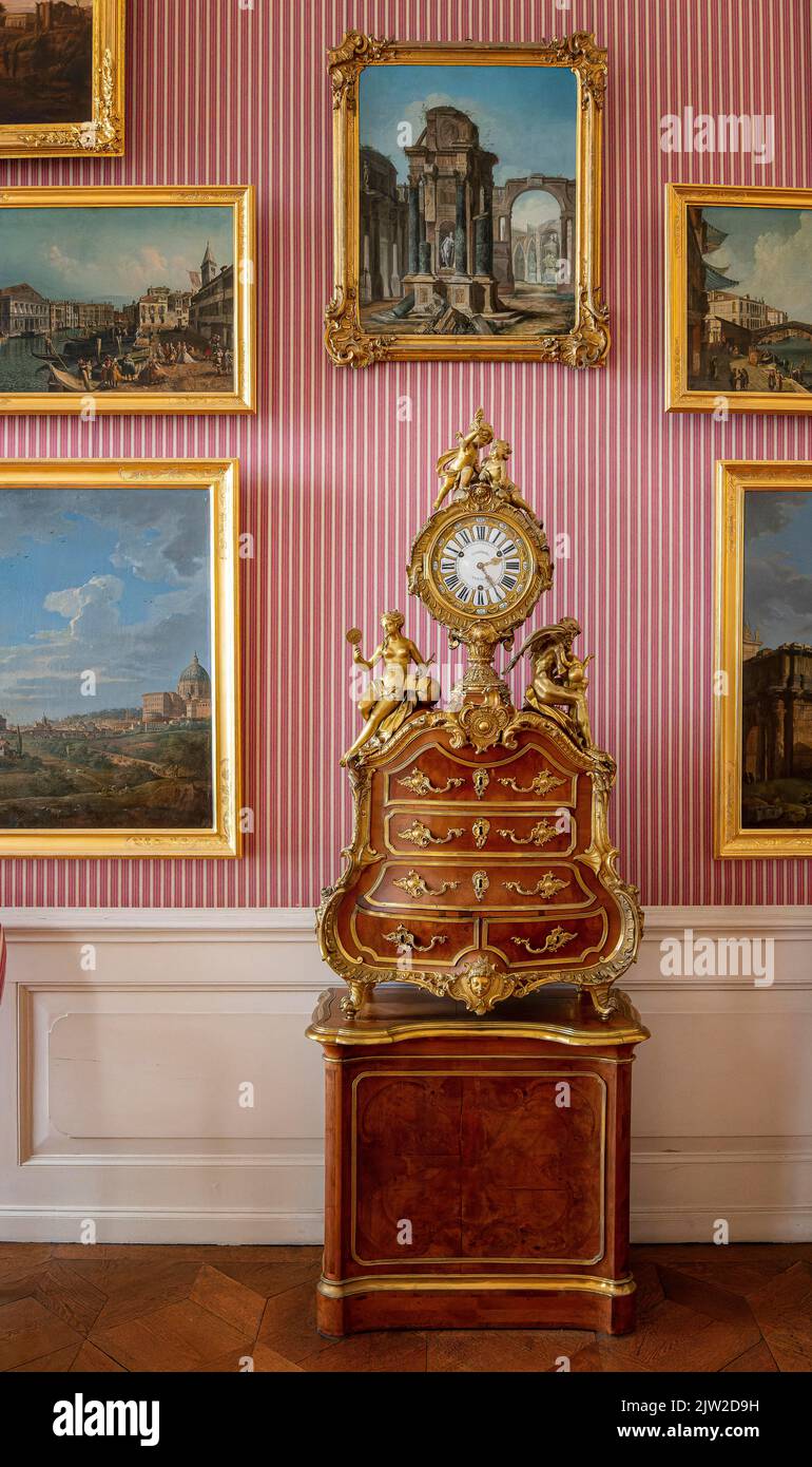 Historical clock on baroque furniture, Sanssouci Palace, Potsdam, Brandenburg, Germany Stock Photo