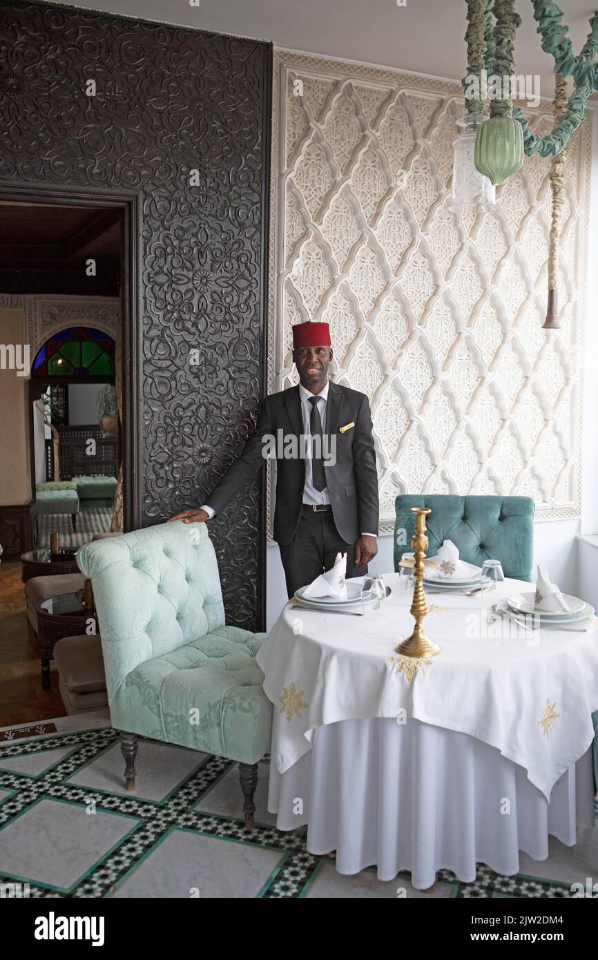 Moroccan maitre dhotel at Riad Maison Bleue, Fes, Morocco Stock Photo