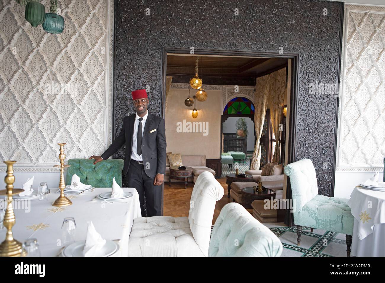 Moroccan maitre dhotel at Riad Maison Bleue, Fes, Morocco Stock Photo