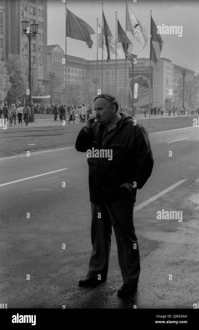 GDR, Berlin, 01. 05. 1987, 1. May rally 1987 on Karl-Marx-Allee, smoking man Stock Photo
