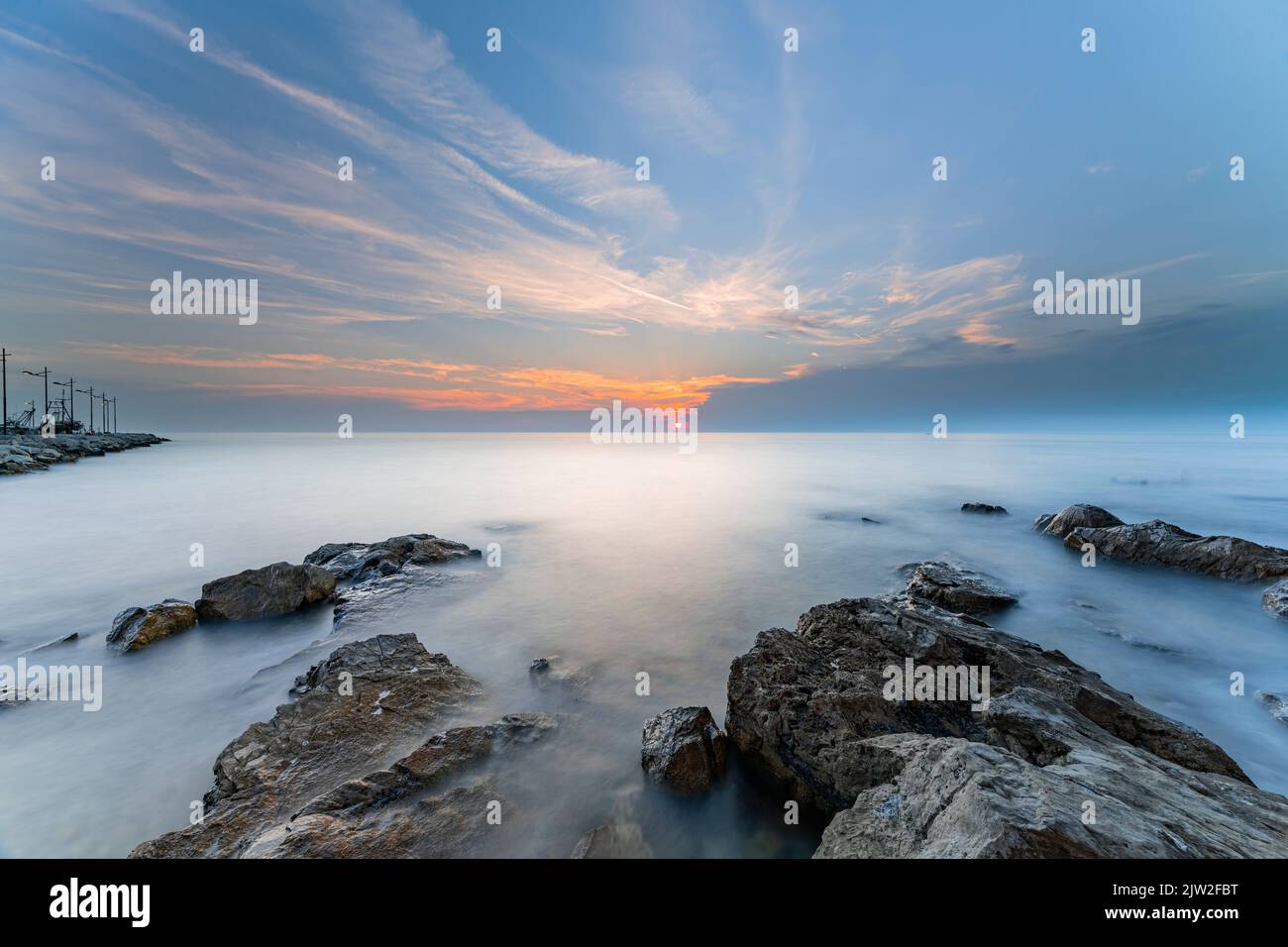 Sunset at a sea Stock Photo - Alamy