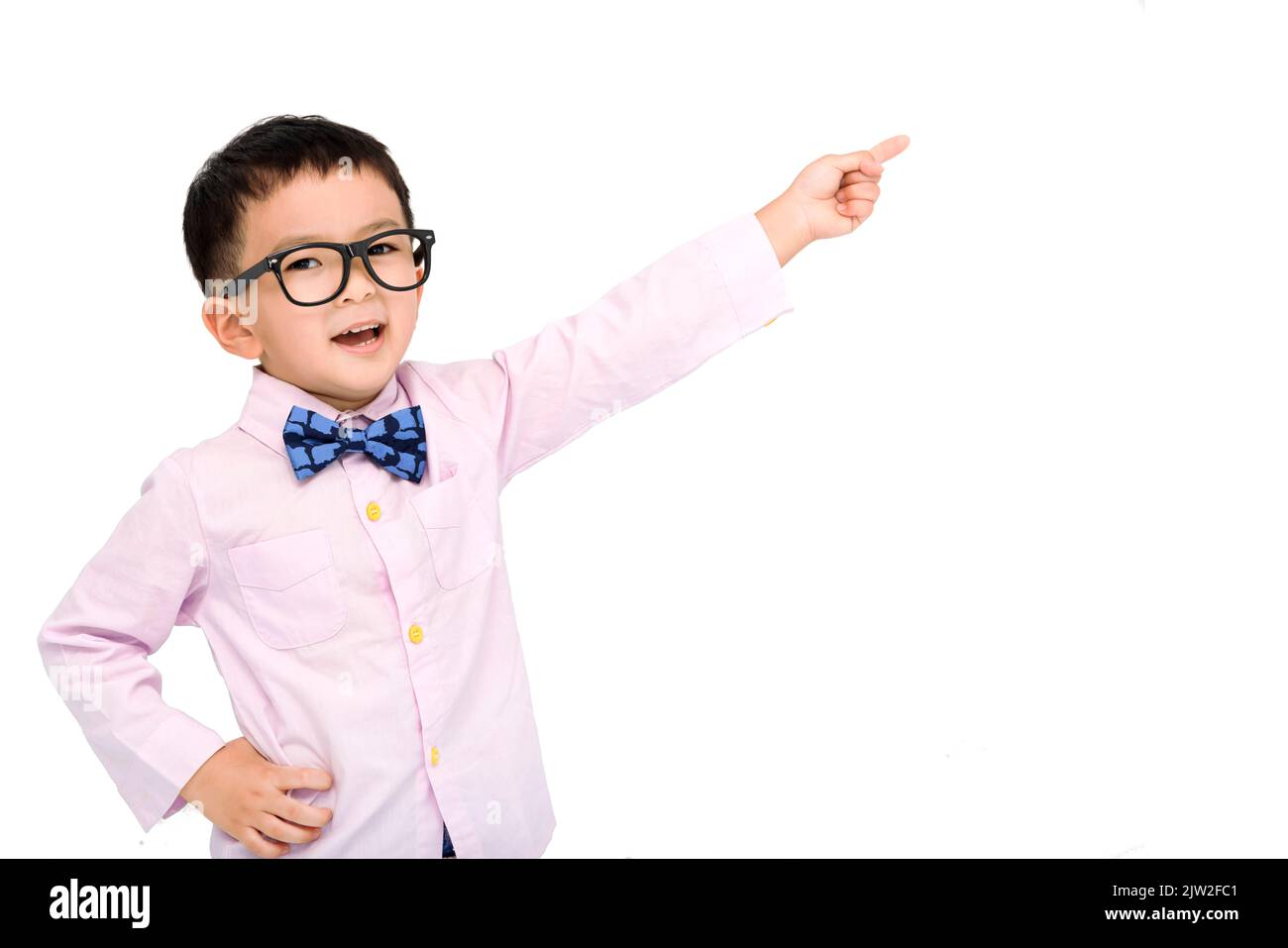 Happy child in a suit  and pointing to copy space Stock Photo