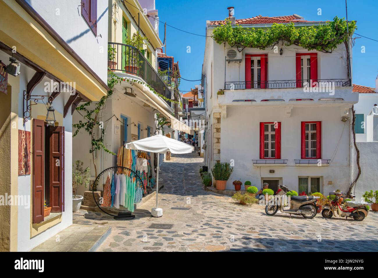 View of shops in narrow street, Skopelos Town, Skopelos Island, Sporades Islands, Greek Islands, Greece, Europe Stock Photo