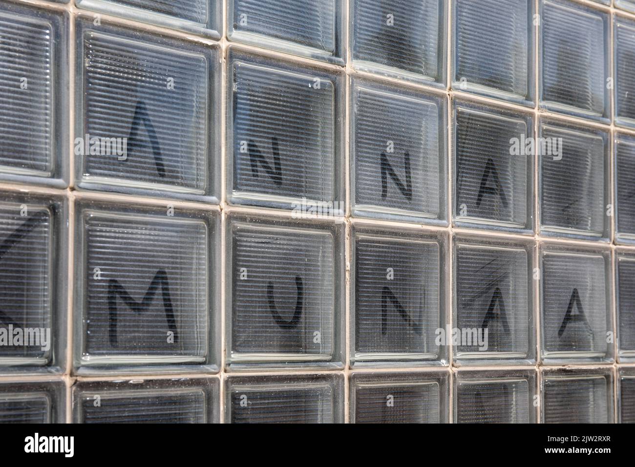 Anna munaa. Text written on dusty or dirty glass block window in Helsinki, Finland. Stock Photo