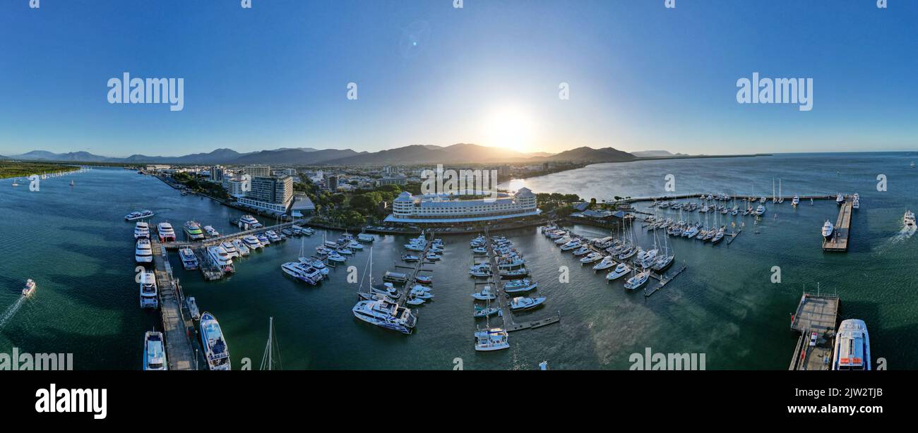 Aerial panorama of Cairns city and boat harbour at sunset Stock Photo
