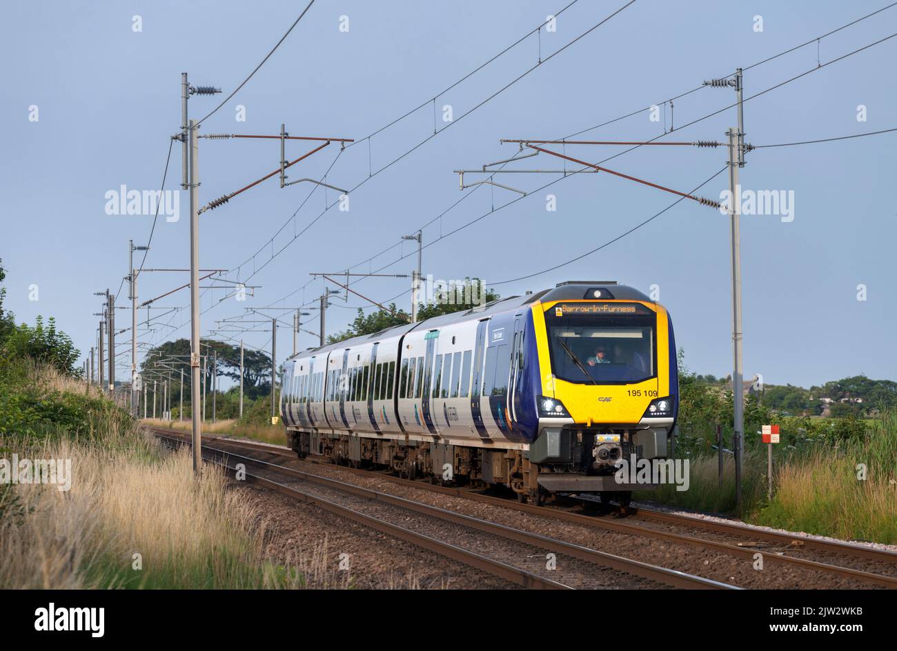Northern Rail CAF class 195 diesel train 195109 on the electrified west coast mainline Stock Photo