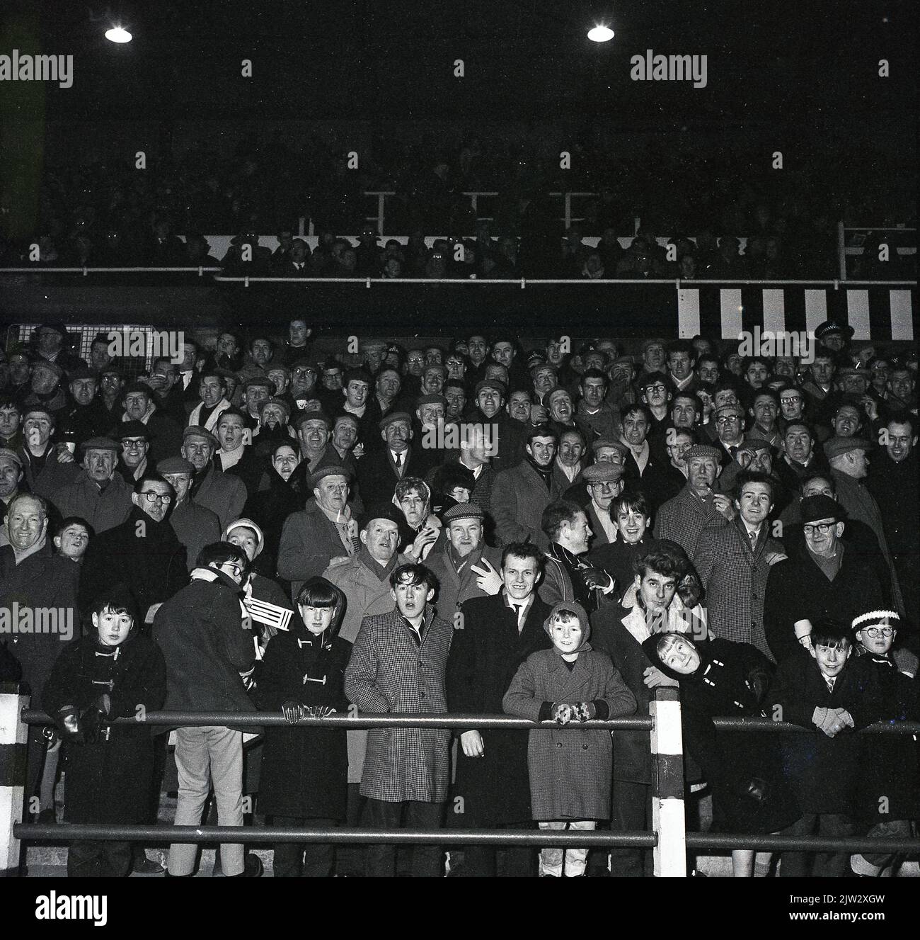 1960s, historical, football fans standing together on a traditional