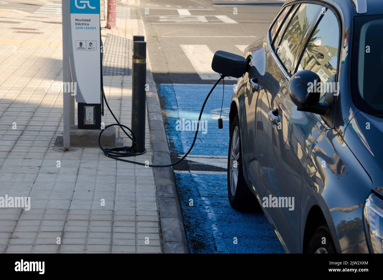 Playa de Arinaga, March 3, 2021 Electric car in a charging station. Aguimes. Gran Canaria