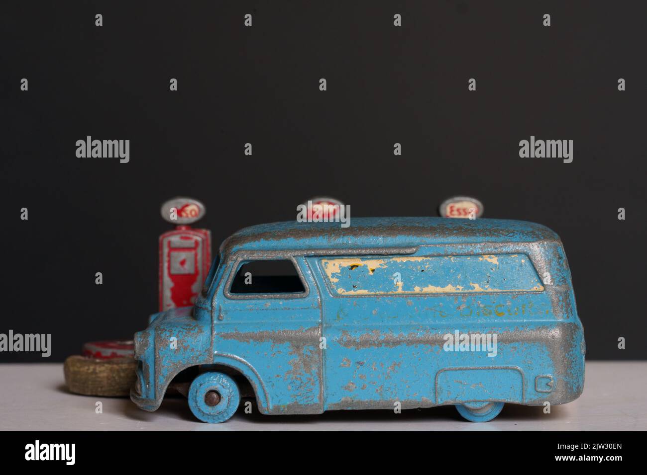 Rusty old toy van and petrol pumps Stock Photo