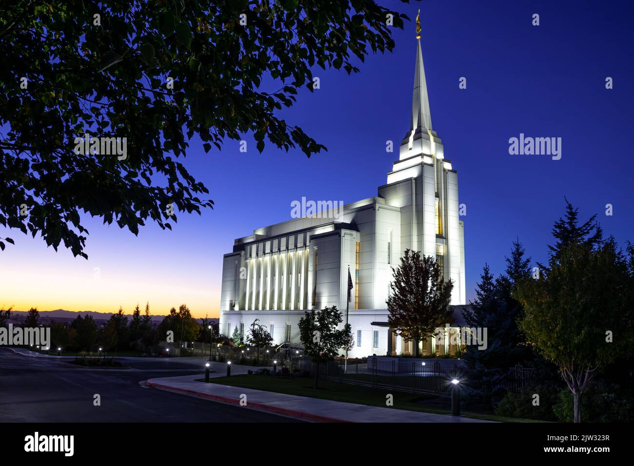 A shot of Rexburg Idaho Lds Temple with the precinct at sunset Stock Photo