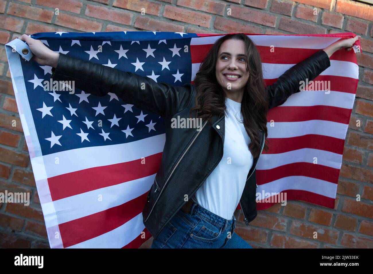 Woman waving american flag hi-res stock photography and images - Alamy