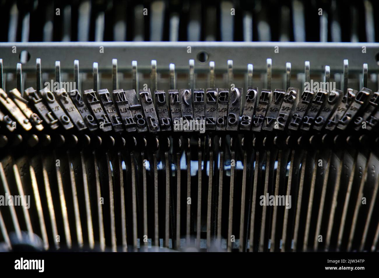 Mechanical hammers with alphabet for typing old typewriter Stock Photo