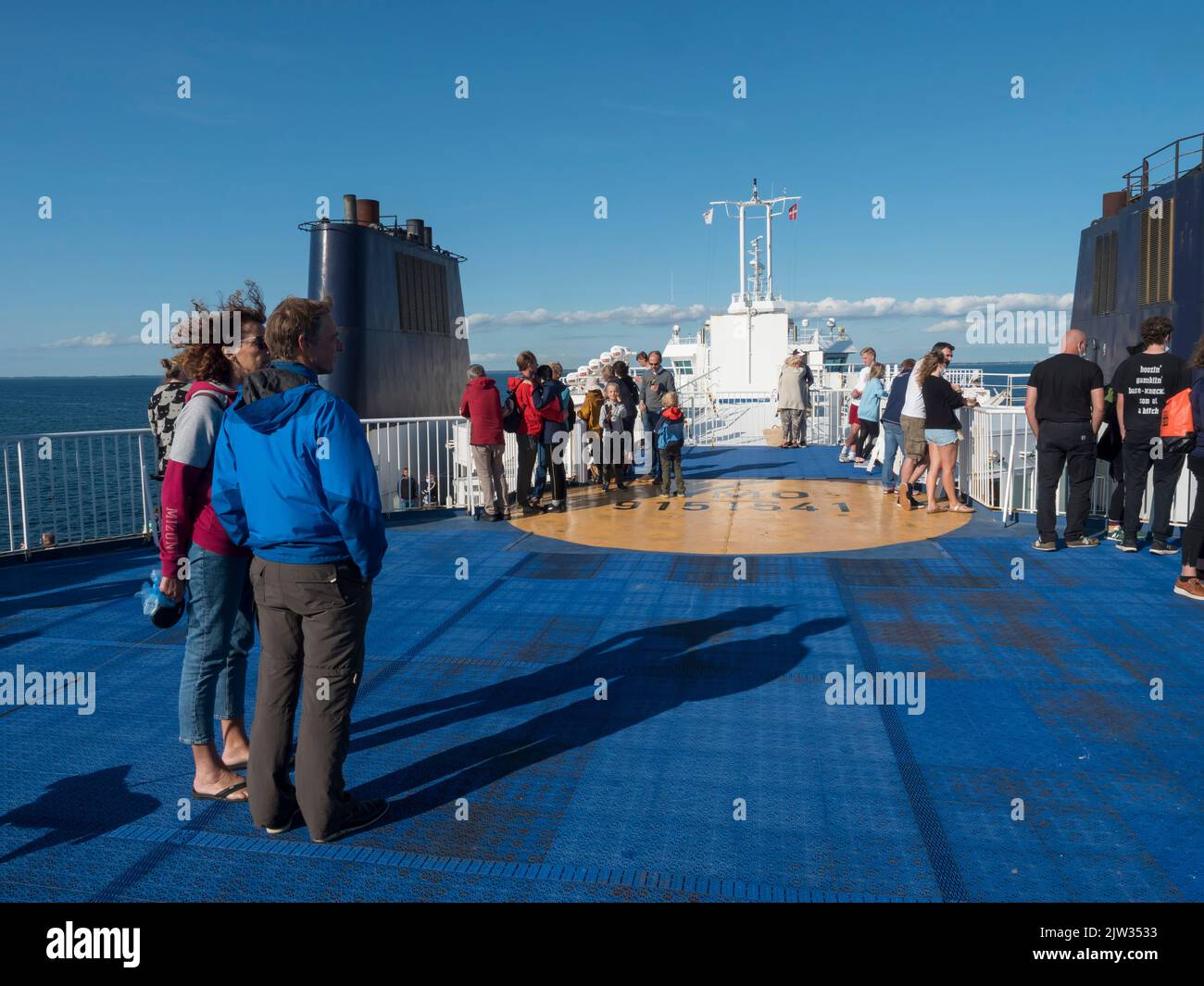Rodbyhavn, Denmark, Agust 21, 2021: People enjoying the cruise and sun on the deck of the Scandlines Hybrid Ferry boat betweene Rodby - Puttgarden. Stock Photo