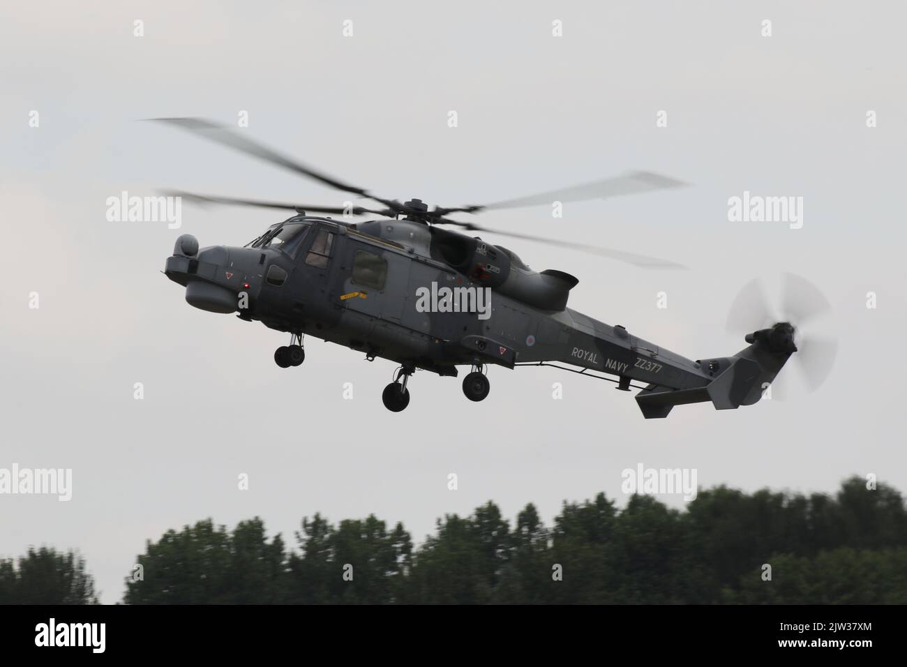 ZZ377, an AgustaWestland Wildcat HMA2 operated by the Royal Navy, arriving at RAF Fairford in Gloucestershire, England, to participate in the Royal International Air Tattoo 2022 (RIAT 2022). Stock Photo