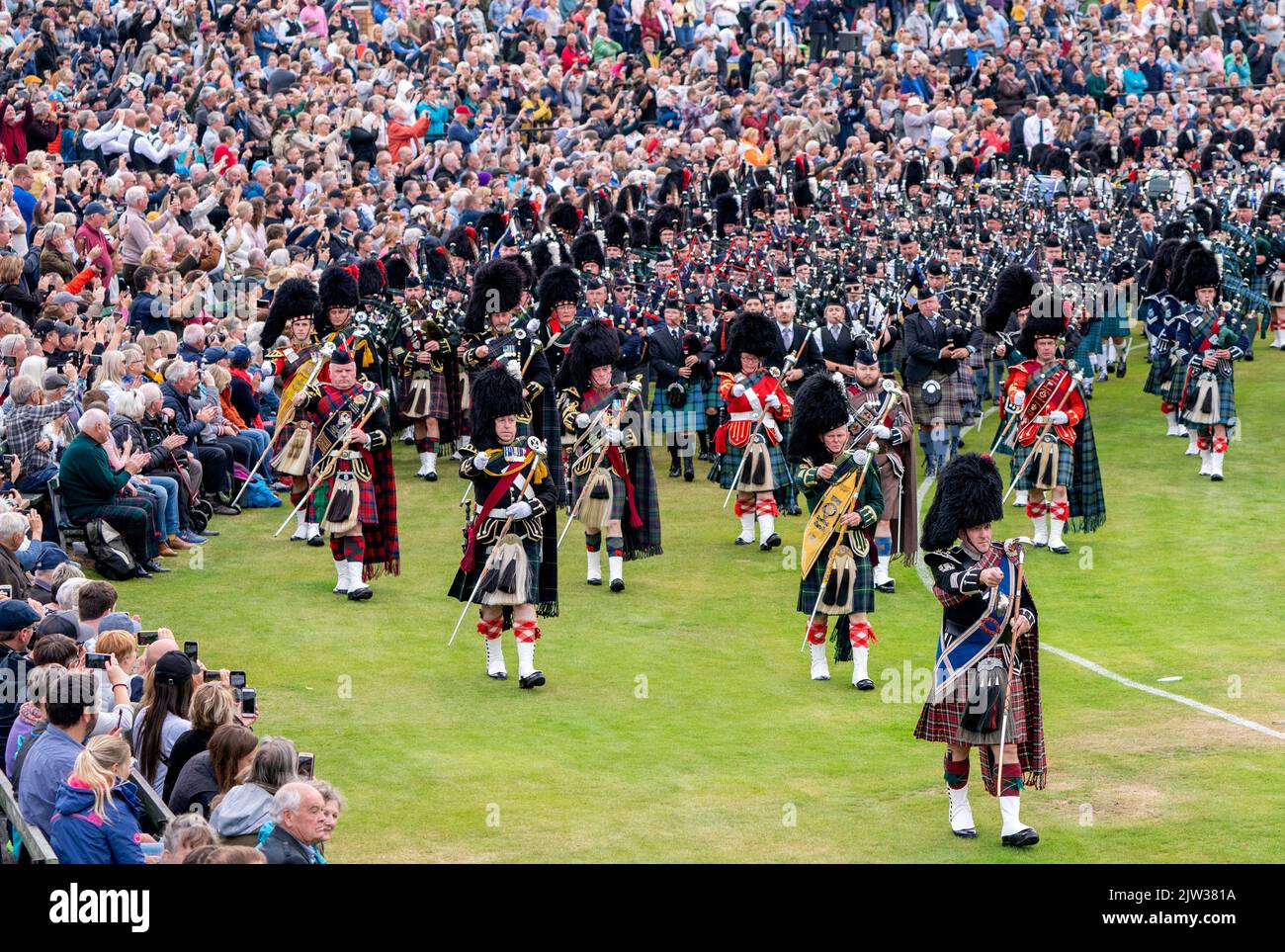 The Massed Pipes and Drums parade in the arena during the Braemar Royal ...