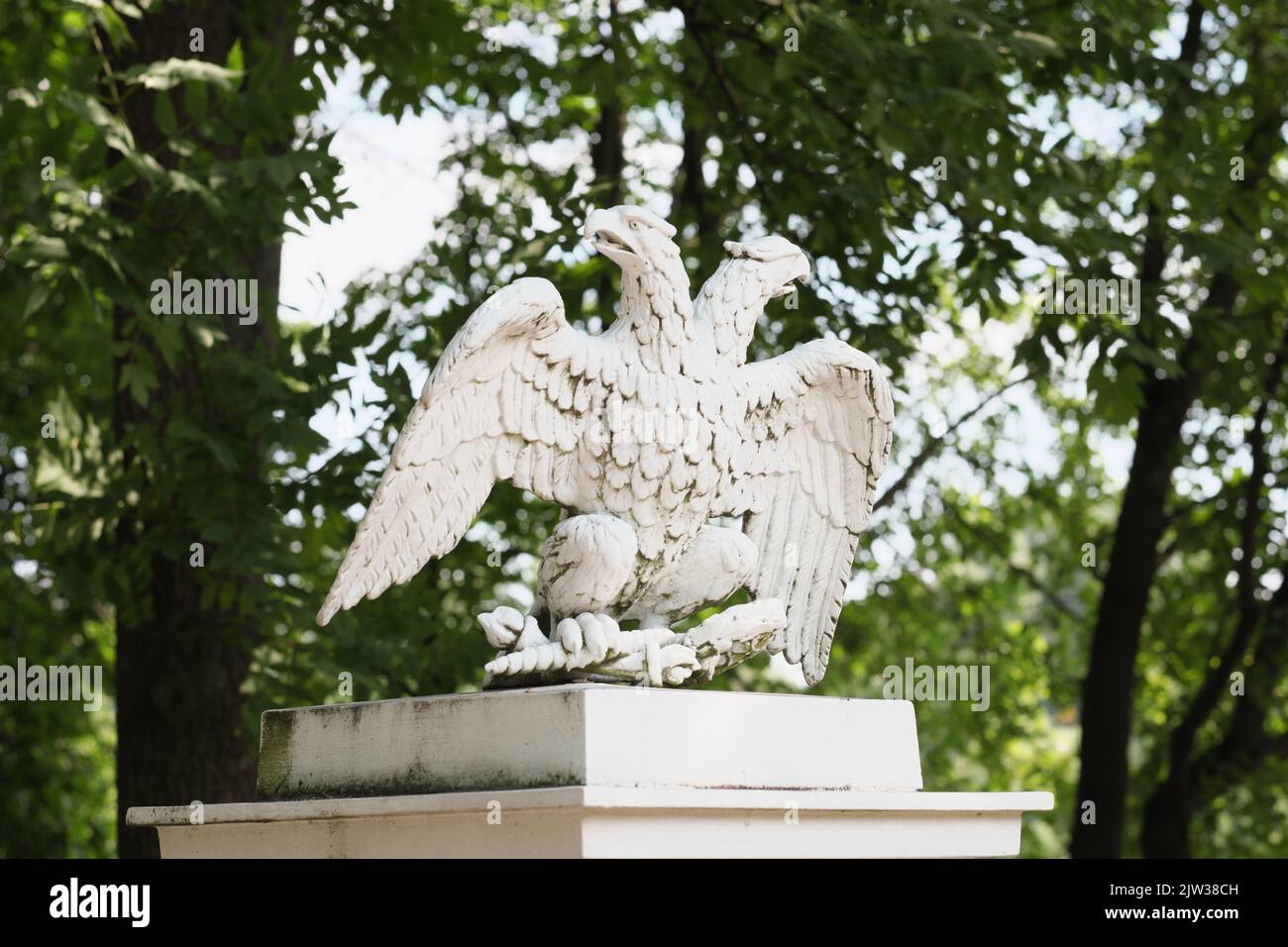 A double-headed eagle stone statue , the symbol of the Russian Federation. The architectural element of the gerden decor Stock Photo