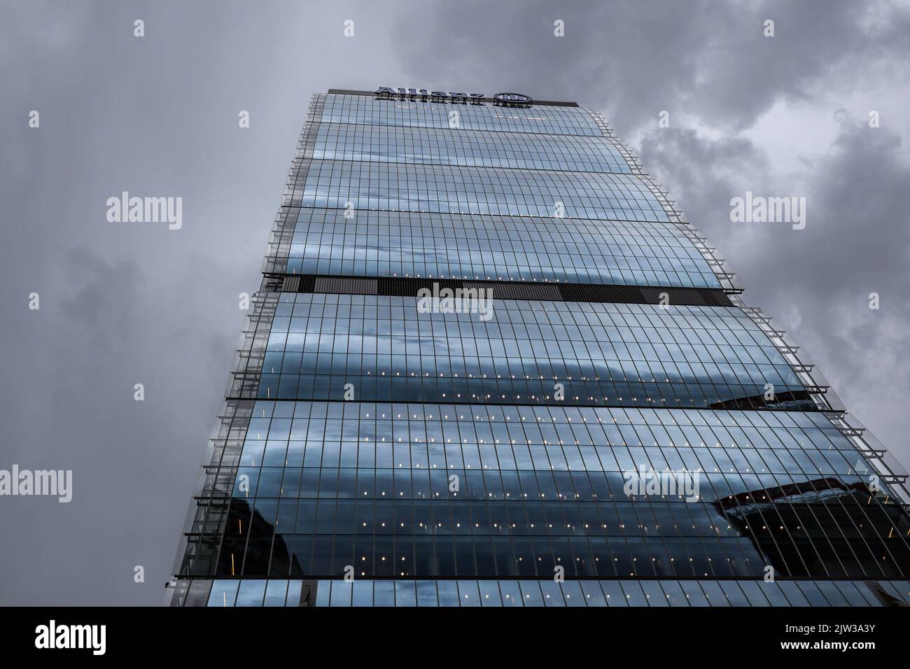 Milan, Italy - June 26, 2022: Allianz Tower is a Modern Building in Lombardy. Below Architecture with Cloudy Sky in CityLife in Tre Torri. Stock Photo