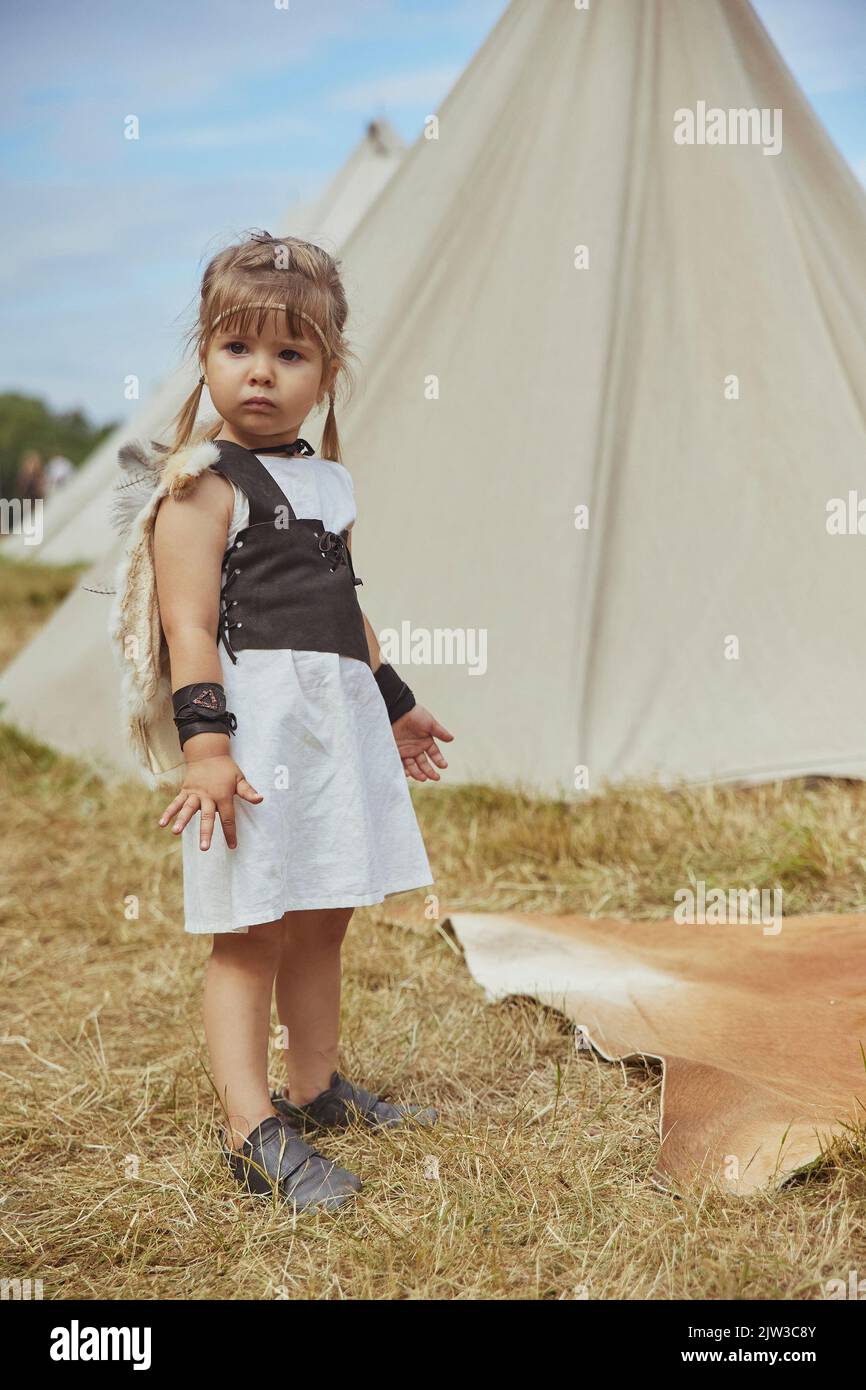 Charming child child in primitive clothes at the viking festival  Stock Photo